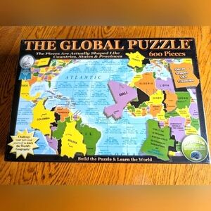The global puzzle a 600 piece jigsaw puzzle of World Geography. Sealed i…